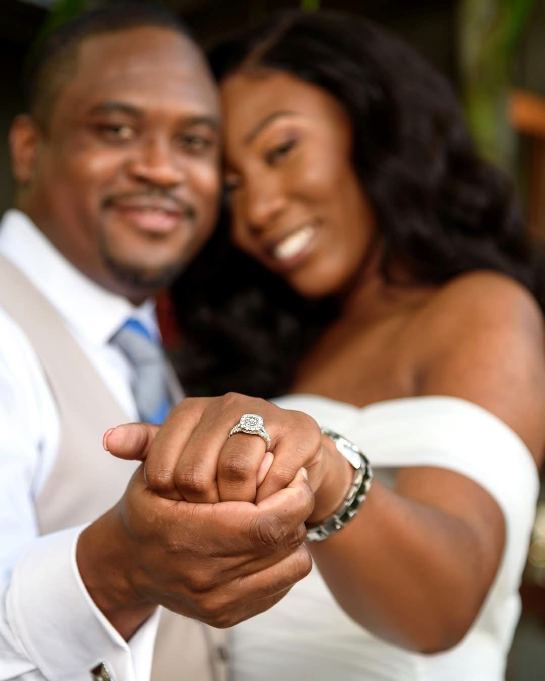 Newly weds show off bride's ring